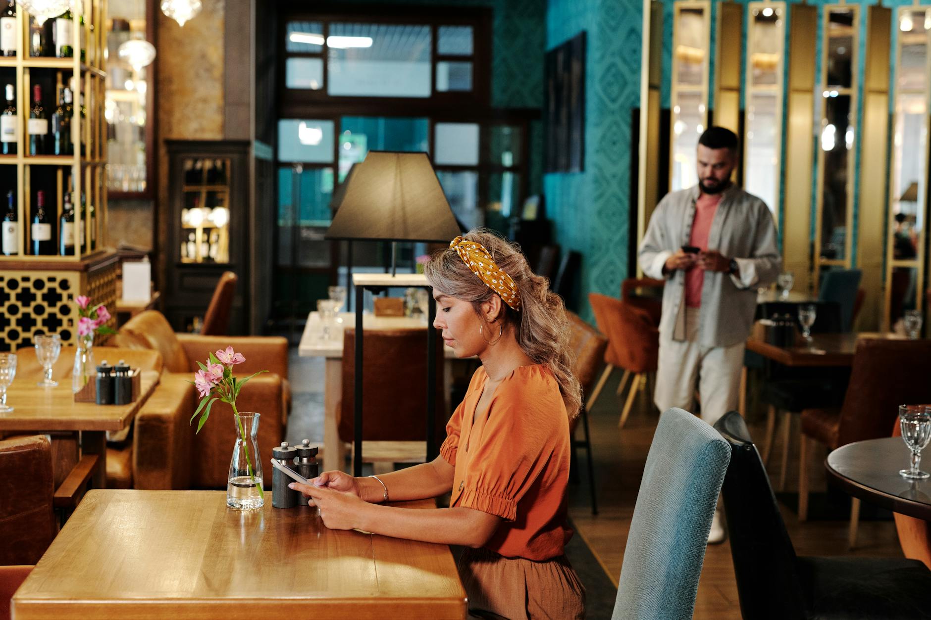 man and woman busy using their cellphones in the restaurant